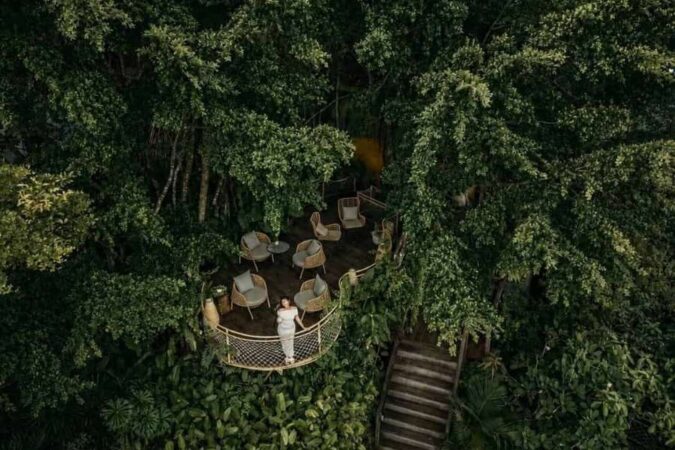 Aerial view of a unique treehouse lounge nestled in the dense jungle canopy of Khao Sok